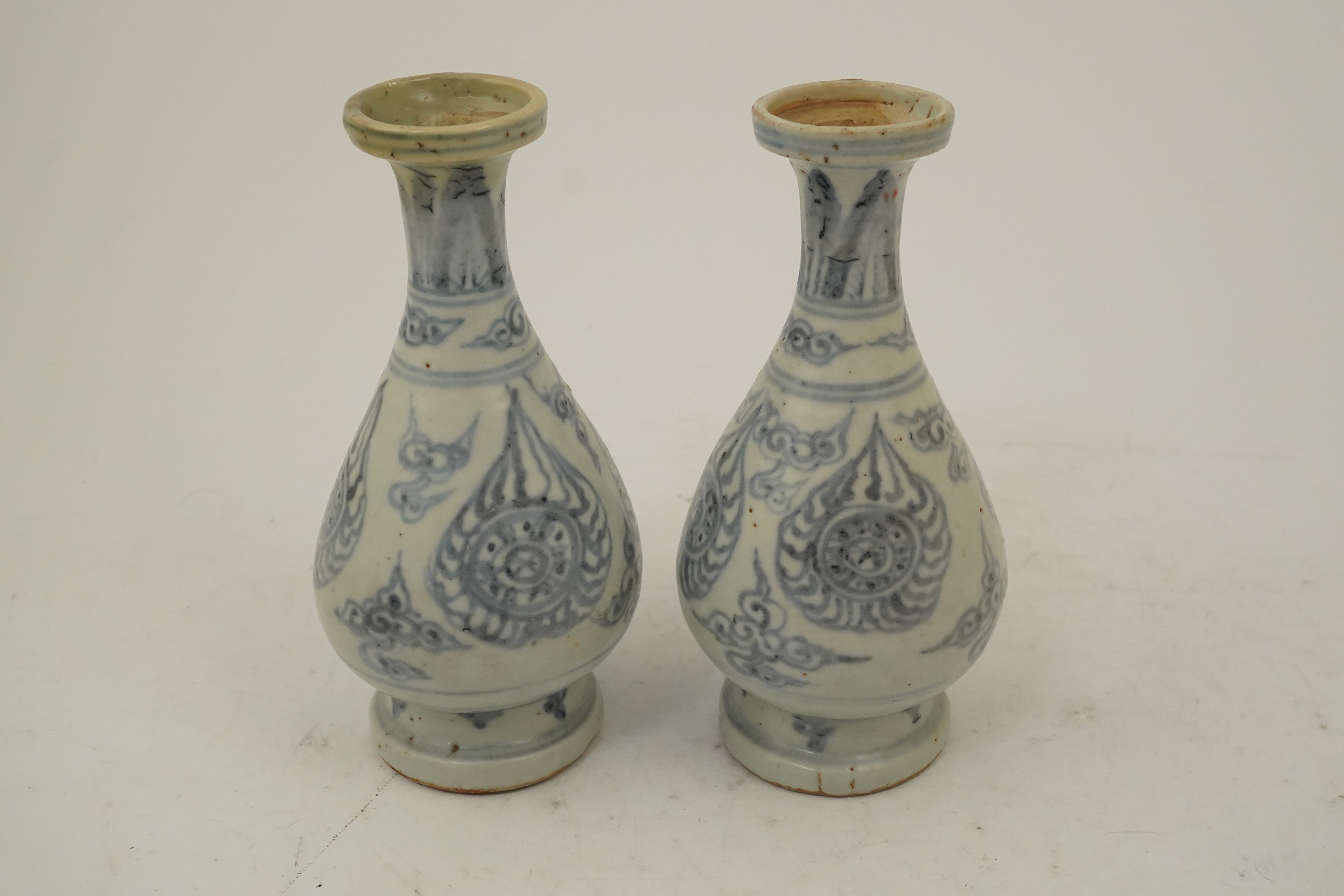 A pair of Chinese blue and white pear-shaped shipwreck vases, Ming dynasty, 15th century
